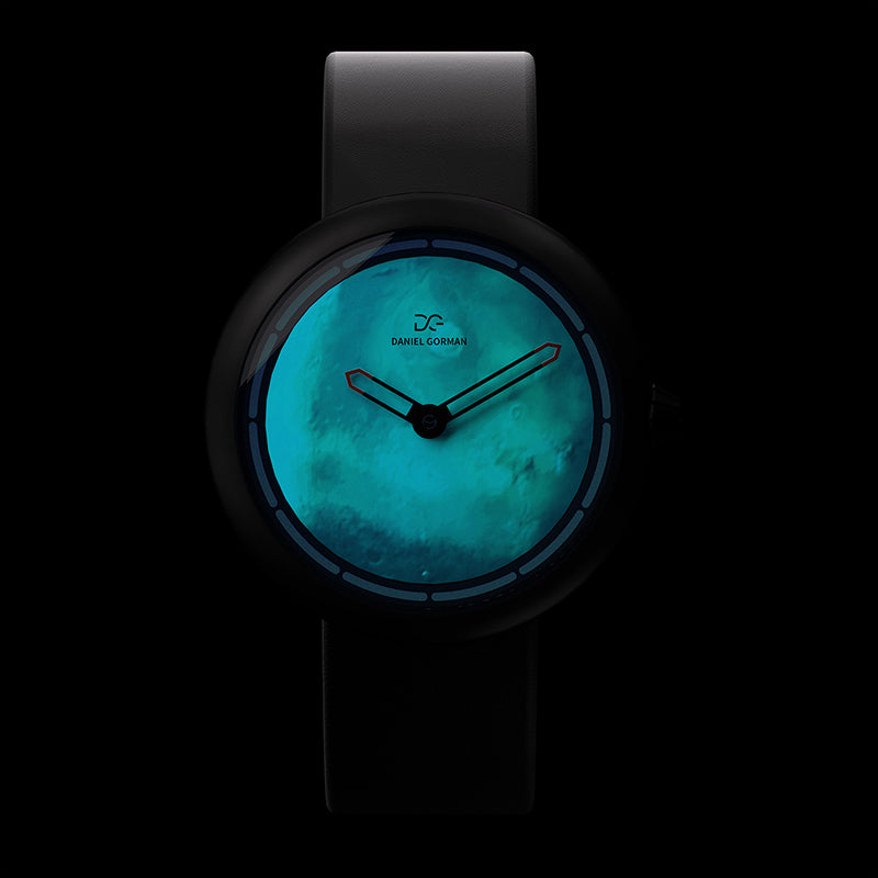 Daniel Gorman Mars red Cow Leather Strap watch glowing in the dark, highlighting luminous hands and futuristic space-inspired functionality.