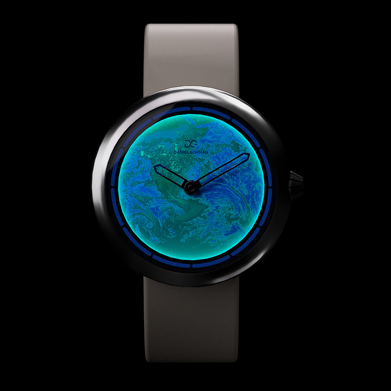 Daniel Gorman Earth white Cow Leather Strap watch glowing in the dark, highlighting luminous hands and futuristic space-inspired functionality.