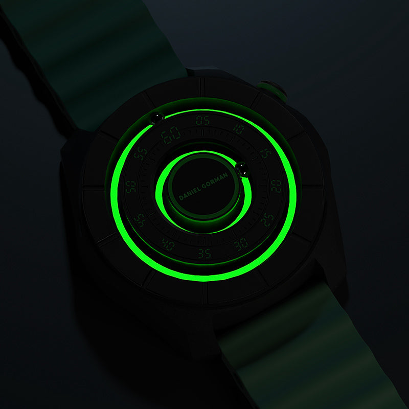 daniel-gorman-dg0788-dual-sphere-magnetic-watch-open-dial-lume-glow
Daniel Gorman dual sphere magnetic watch with open dial glowing in the dark, showcasing luminous elements and a futuristic design.