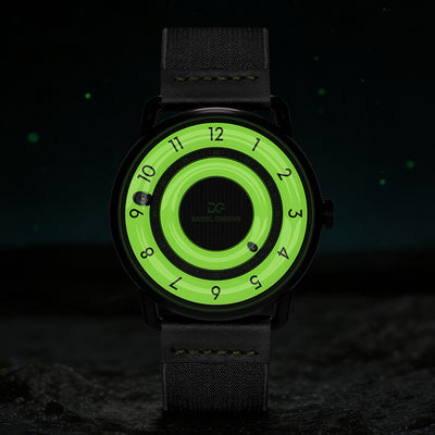 Daniel Gorman Quartz Gravity watch glowing in the dark, highlighting luminous hands and its magnetic levitation display in low light conditions.