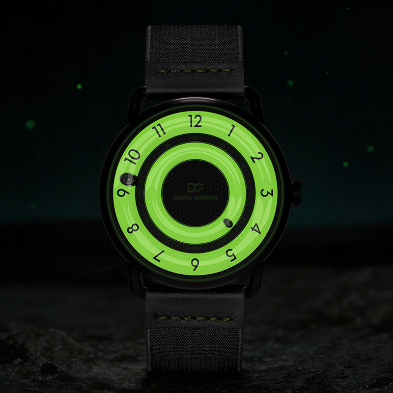 Daniel Gorman Quartz Gravity watch glowing in the dark, highlighting luminous hands and its magnetic levitation display in low light conditions.