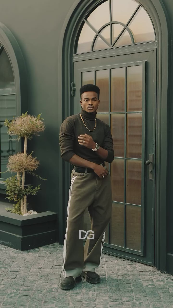 18-second lifestyle video of a model wearing the Daniel Gorman DG8127.QB mechanical watch, showcasing its luminous dial and bold industrial design in a cinematic urban atmosphere.